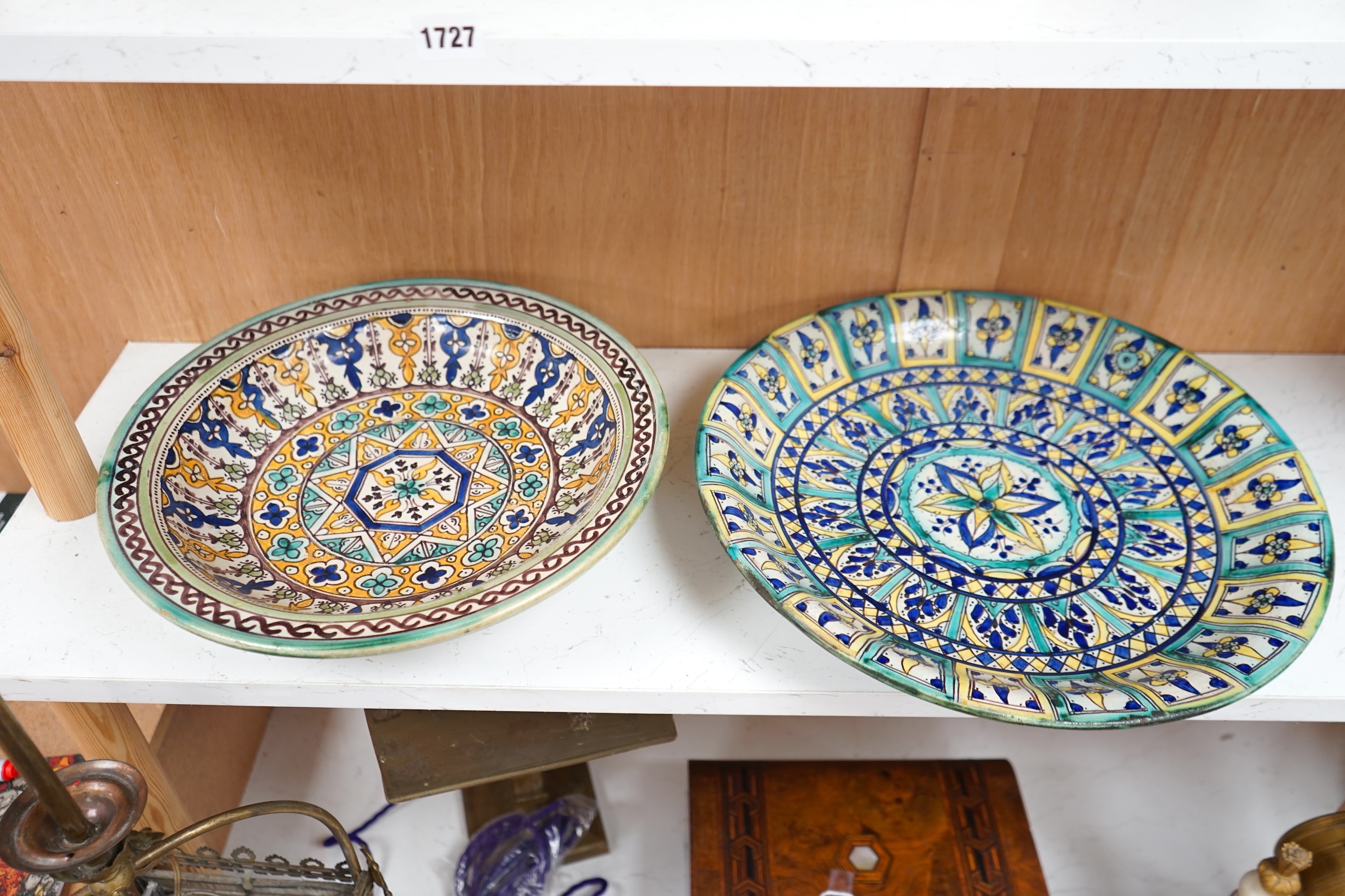 Two 19th/20th century Moroccan polychrome pottery dishes, 41cm diameter. Condition - fair to good